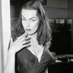 Actress Maila Nurmi as Vampira in a black corseted dress