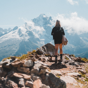 A hiker admires the view from a peak