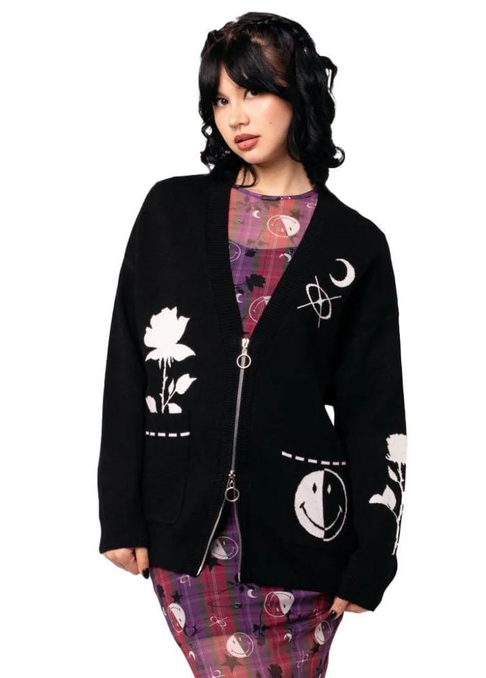 Woman in a black motif cardigan